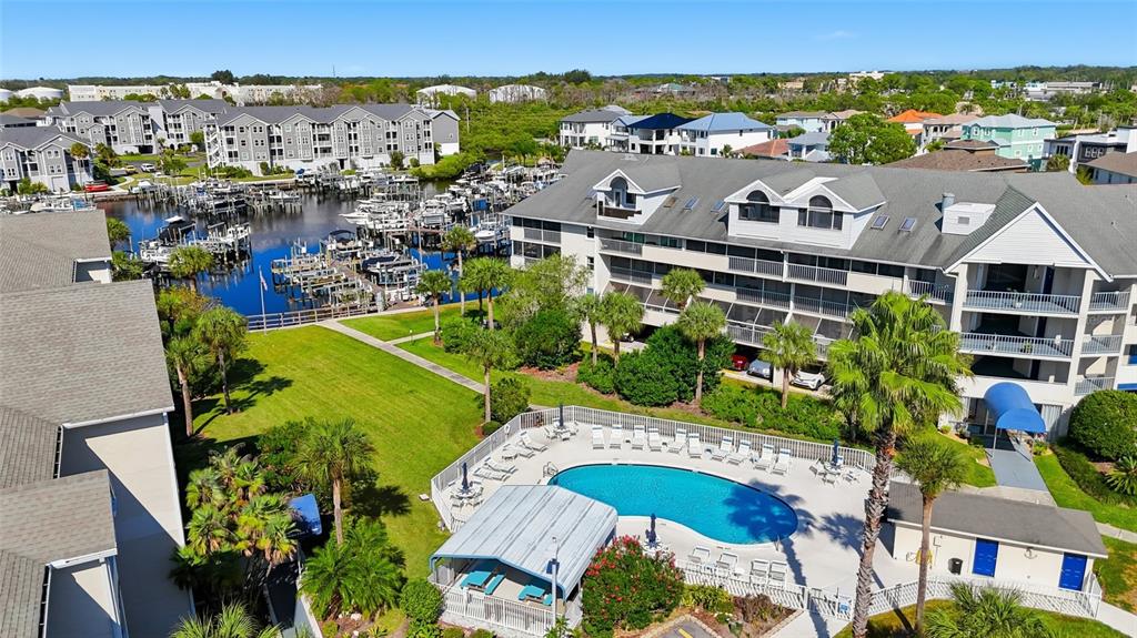 5567 Sea Forest Drive, Unit 323 New Port Richey, FL 34652 - Photo 5 of 37 an aerial view of a house with a swimming pool yard and outdoor seating