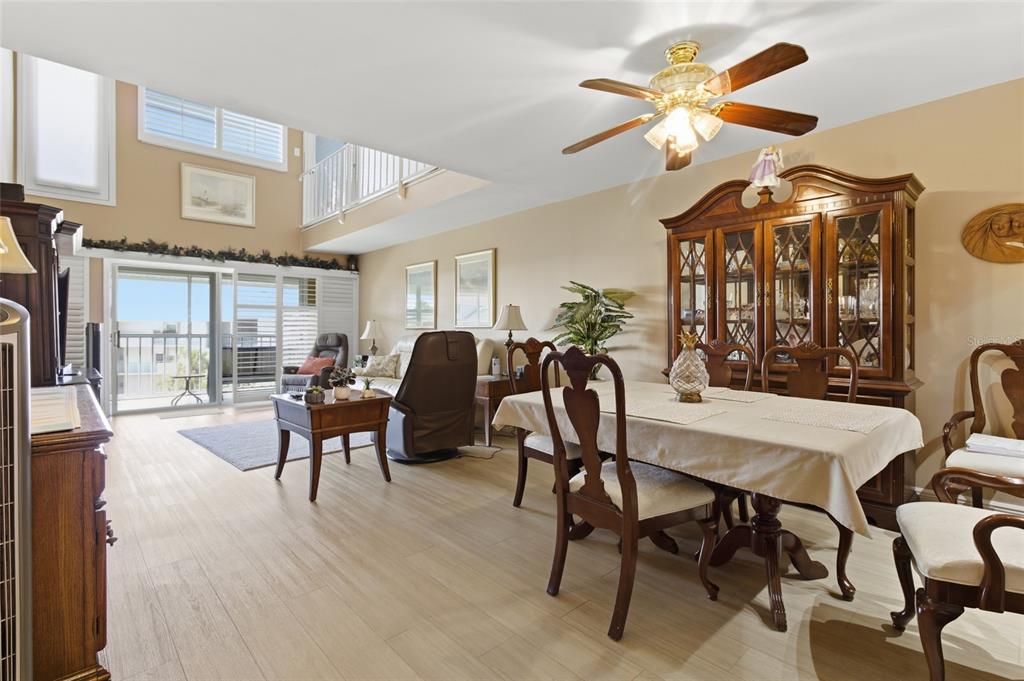 5567 Sea Forest Drive, Unit 323 New Port Richey, FL 34652 - Photo 8 of 37 a view of a dining room with furniture and a chandelier
