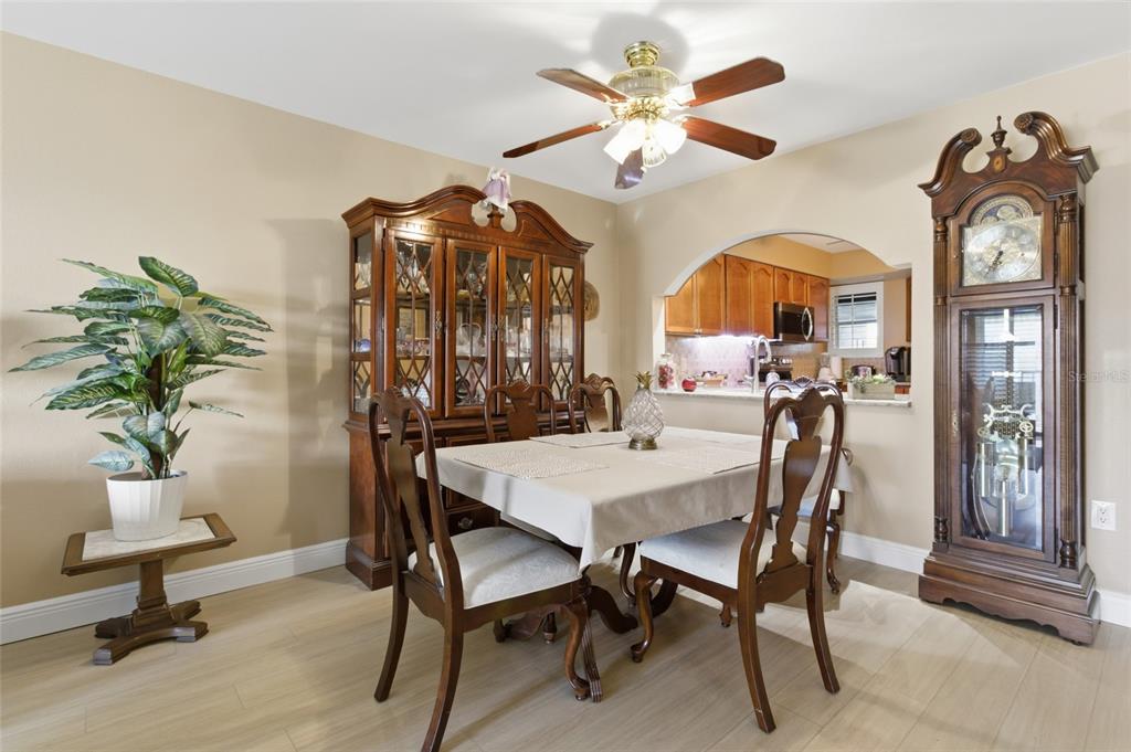 5567 Sea Forest Drive, Unit 323 New Port Richey, FL 34652 - Photo 9 of 37 a view of a dining room with furniture