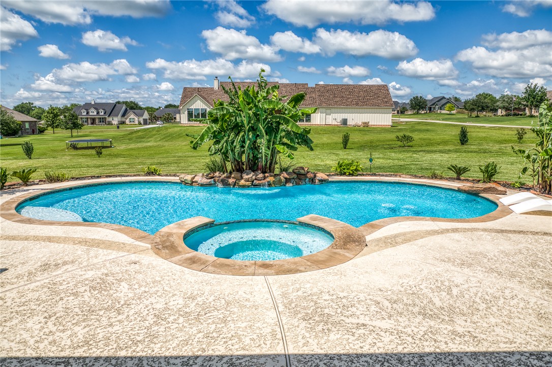 586 Ruby Drive Bellville, TX 77418 - Photo 32 of 50 a view of a swimming pool and a yard