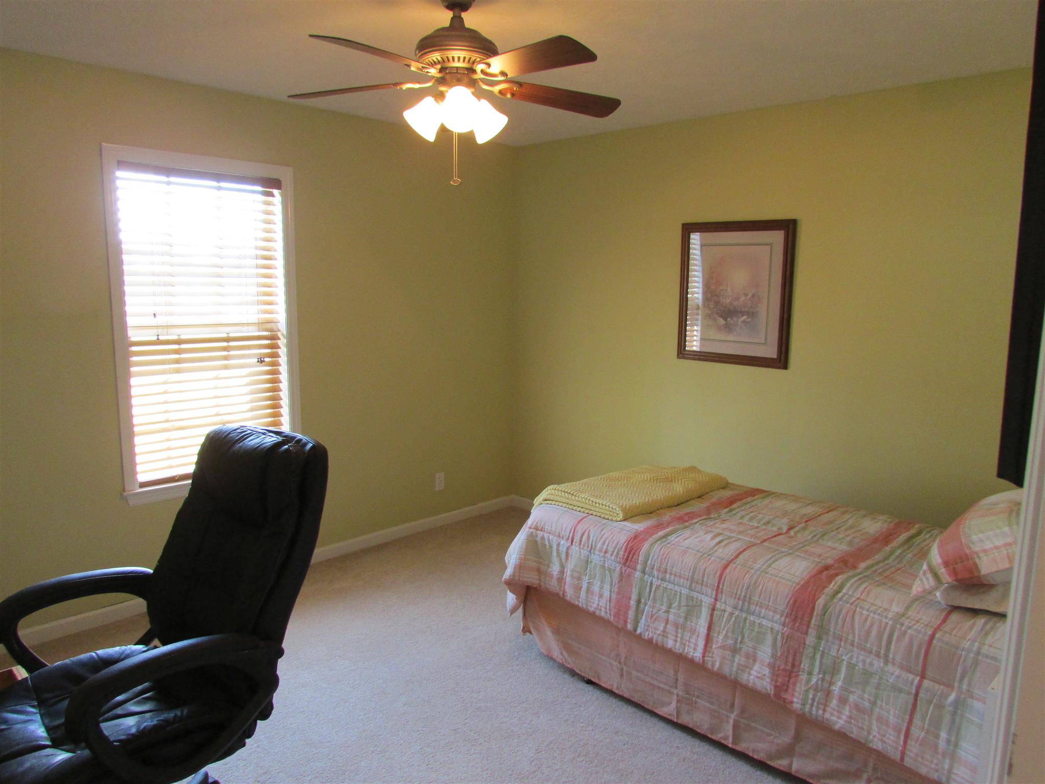 94 Ferrells Loop Road Manchester, TN 37355 - Photo 11 of 17 a bedroom with a bed and chair
