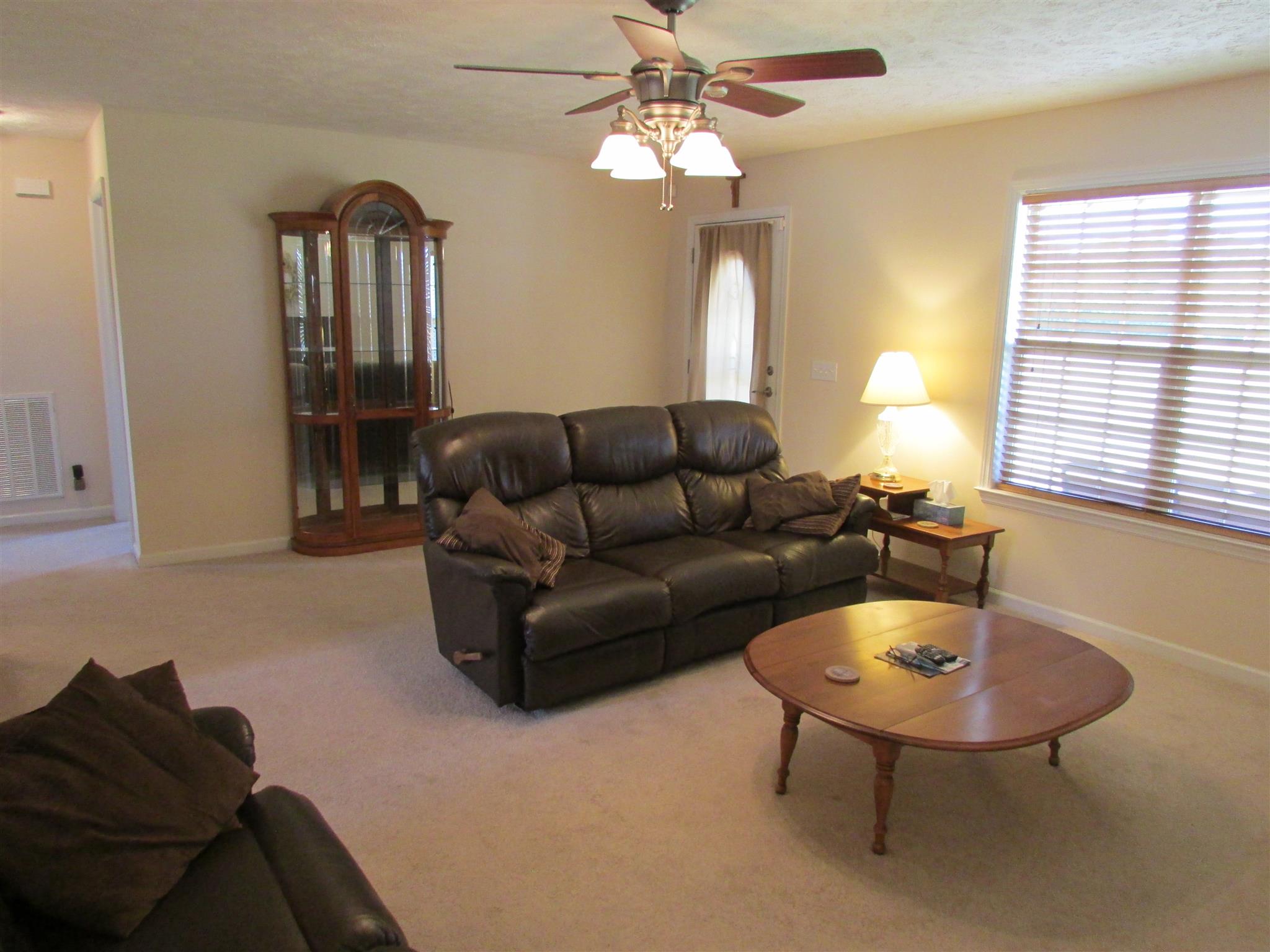 94 Ferrells Loop Road Manchester, TN 37355 - Photo 4 of 17 a living room with furniture a window and a chandelier