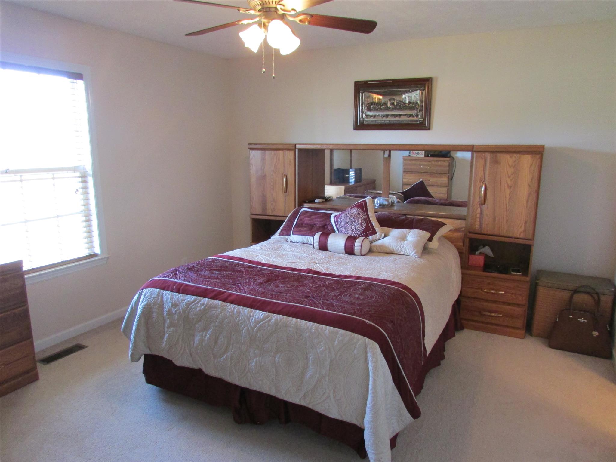 94 Ferrells Loop Road Manchester, TN 37355 - Photo 8 of 17 a bedroom with a bed and a chandelier