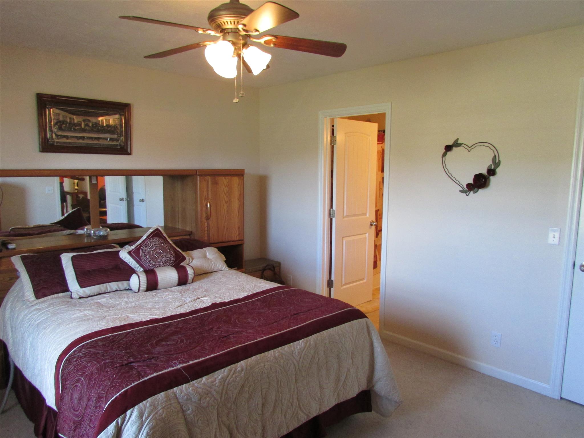 94 Ferrells Loop Road Manchester, TN 37355 - Photo 10 of 17 a bedroom with a large bed and a chandelier