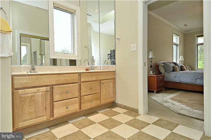 11505 Big Piney Way Potomac, MD 20854 - Photo 17 of 29 a en suite bathroom with sink mirror and