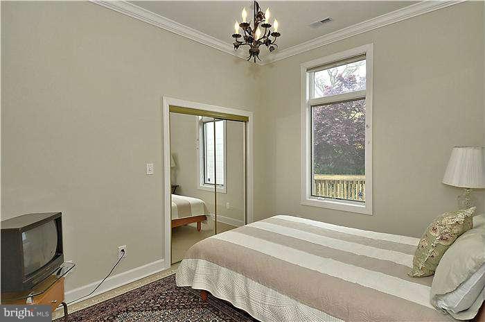 11505 Big Piney Way Potomac, MD 20854 - Photo 18 of 29 a bedroom with a bed and a window