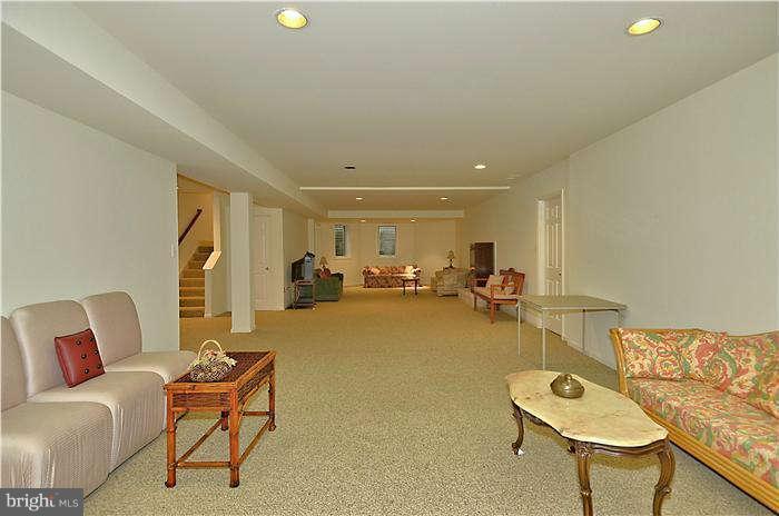 11505 Big Piney Way Potomac, MD 20854 - Photo 24 of 29 a living room with furniture and a table