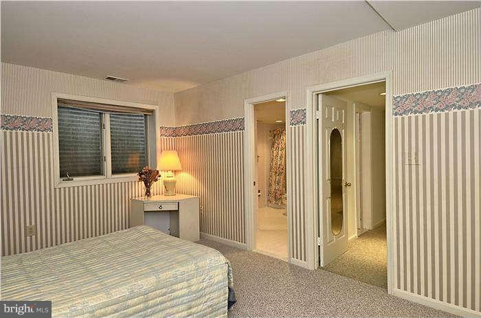 11505 Big Piney Way Potomac, MD 20854 - Photo 25 of 29 a bedroom with a bed and a window