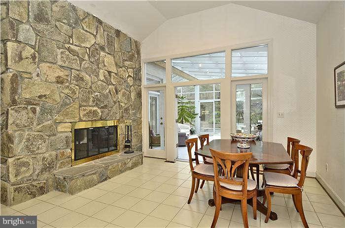 11505 Big Piney Way Potomac, MD 20854 - Photo 10 of 29 a dining room with fireplace furniture and windows