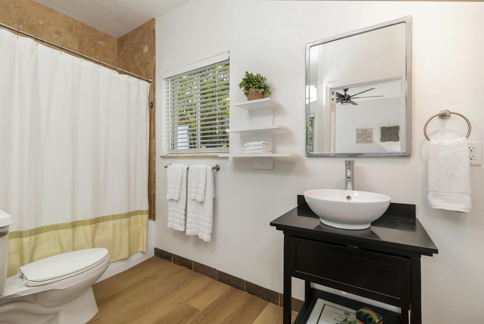 248 Cortez Road West Palm Beach, FL 33405 - Photo 13 of 27 a bathroom with a sink toilet and mirror