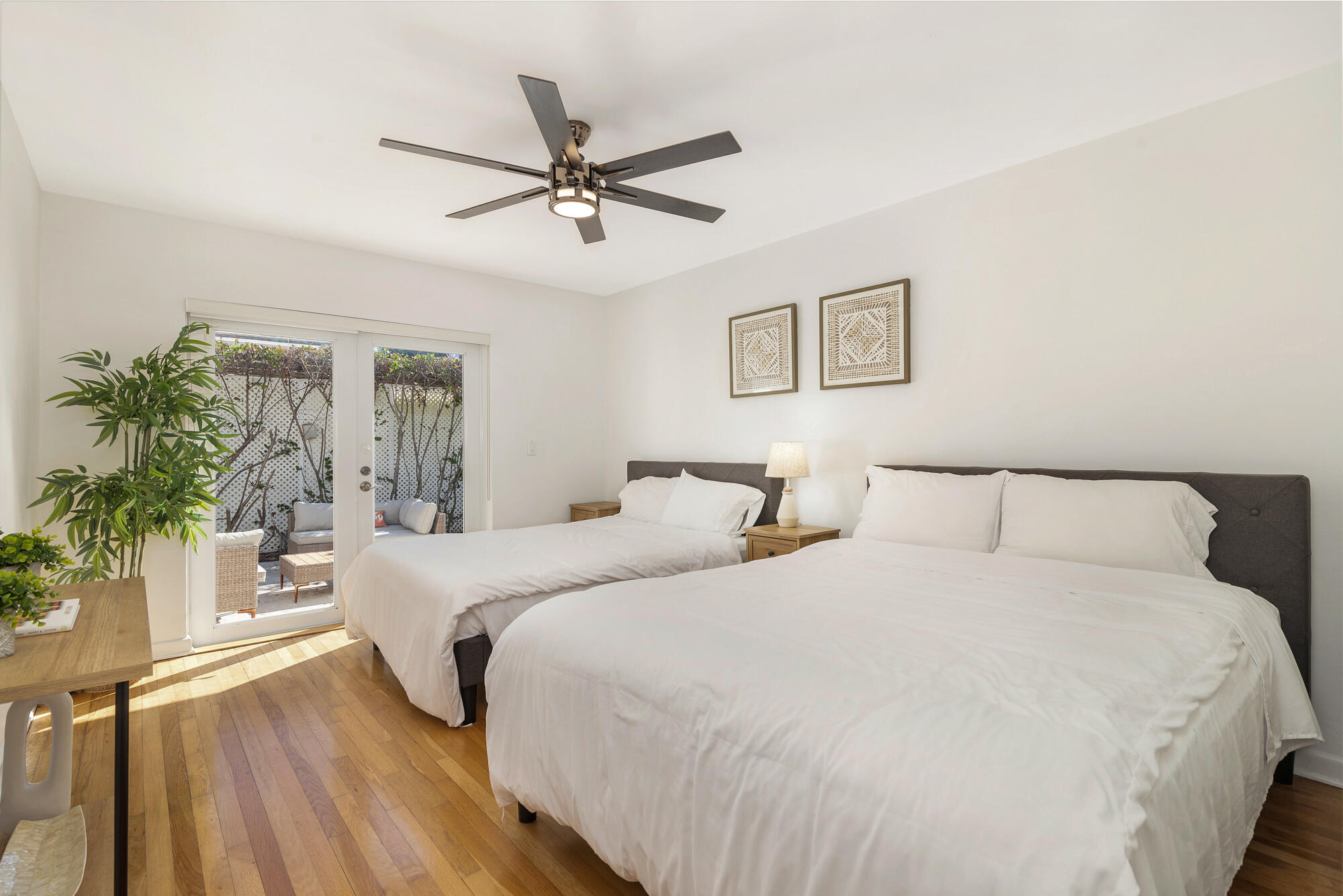 248 Cortez Road West Palm Beach, FL 33405 - Photo 14 of 27 a bedroom with a large bed and a chandelier
