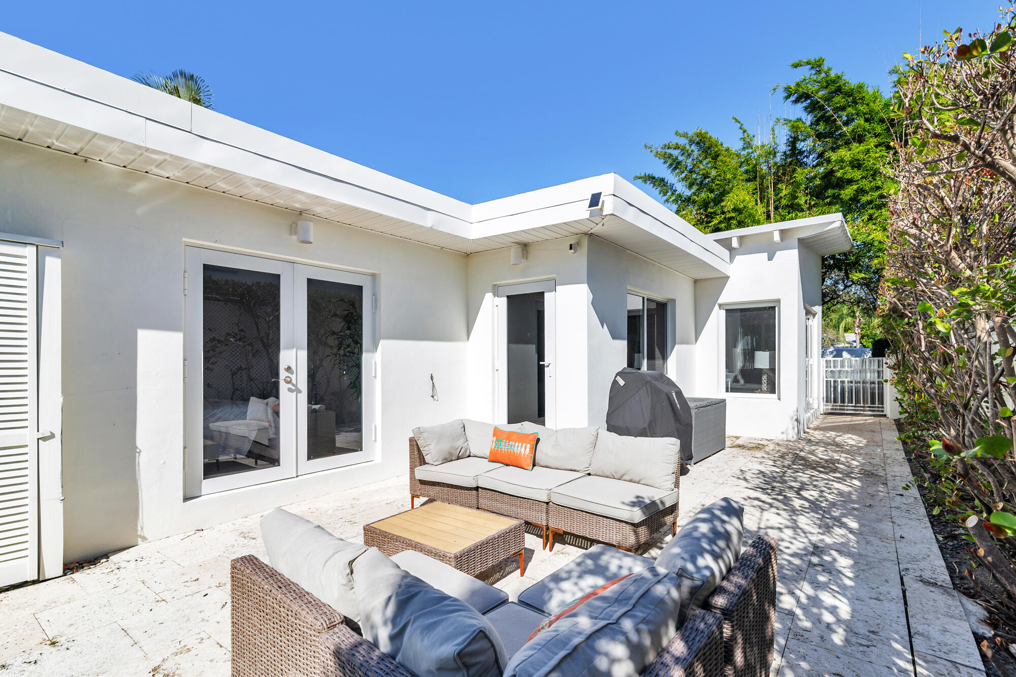 248 Cortez Road West Palm Beach, FL 33405 - Photo 21 of 27 a view of a patio with couches table and chairs and potted plants