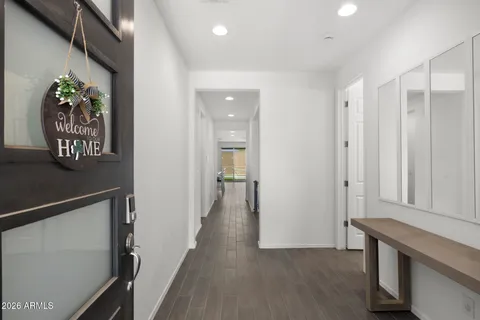 a view of hallway with wooden floor