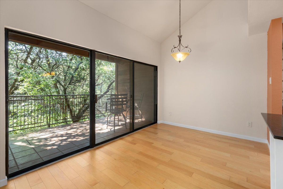 4711 Spicewood Springs Road, Unit 4222 Austin, TX 78759 - Photo 3 of 35 Floor-to-ceiling glass sliders reveal an inviting outdoor balcony, perfect for alfresco dining.
