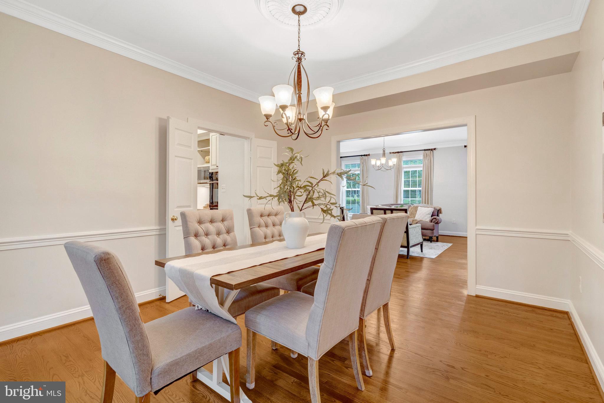 11181 Longwood Grove Drive Reston, VA 20194 - Photo 14 of 94 a view of a dining room with furniture and wooden floor