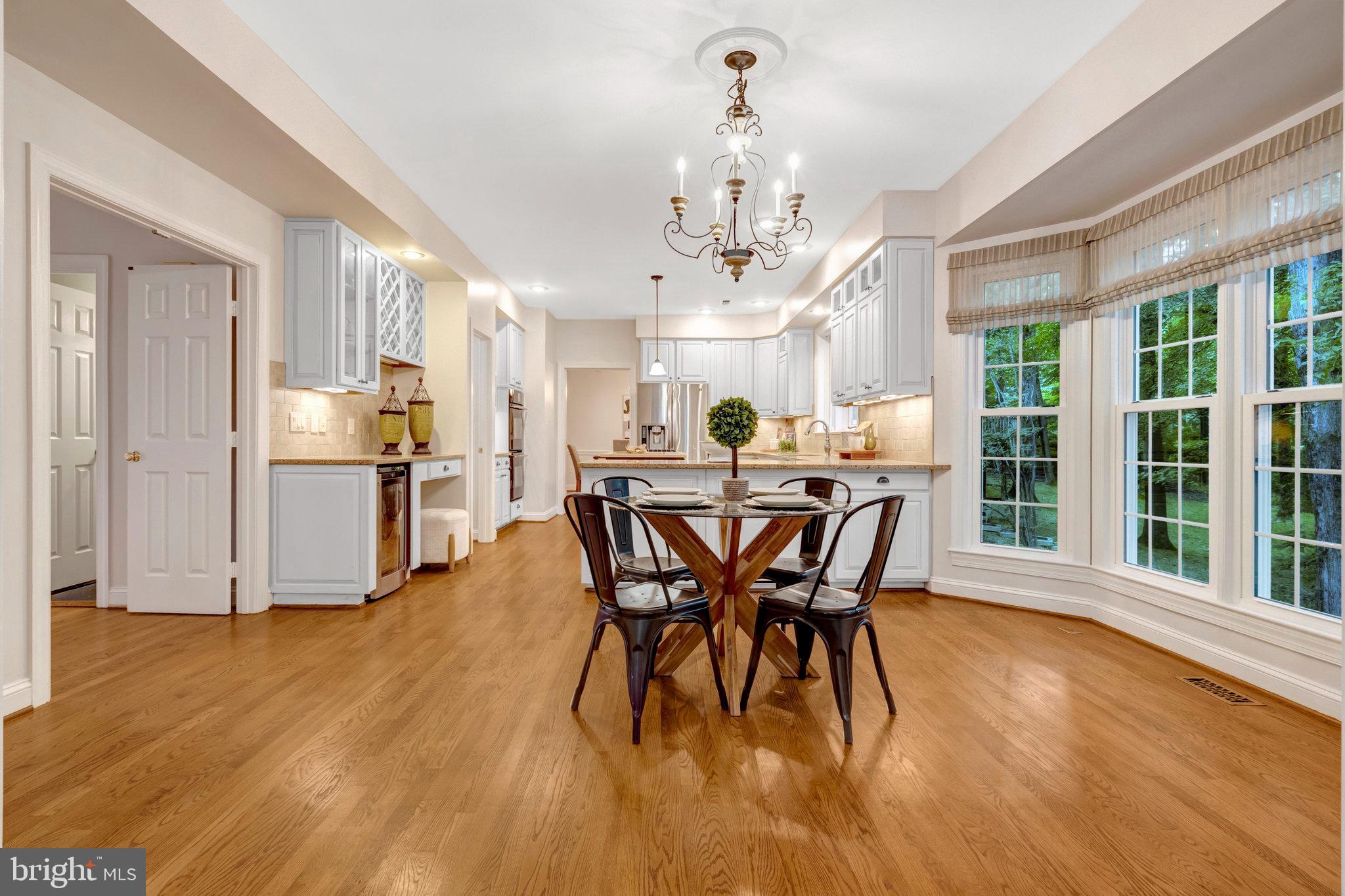 11181 Longwood Grove Drive Reston, VA 20194 - Photo 23 of 94 a view of a dining room with furniture window and wooden floor