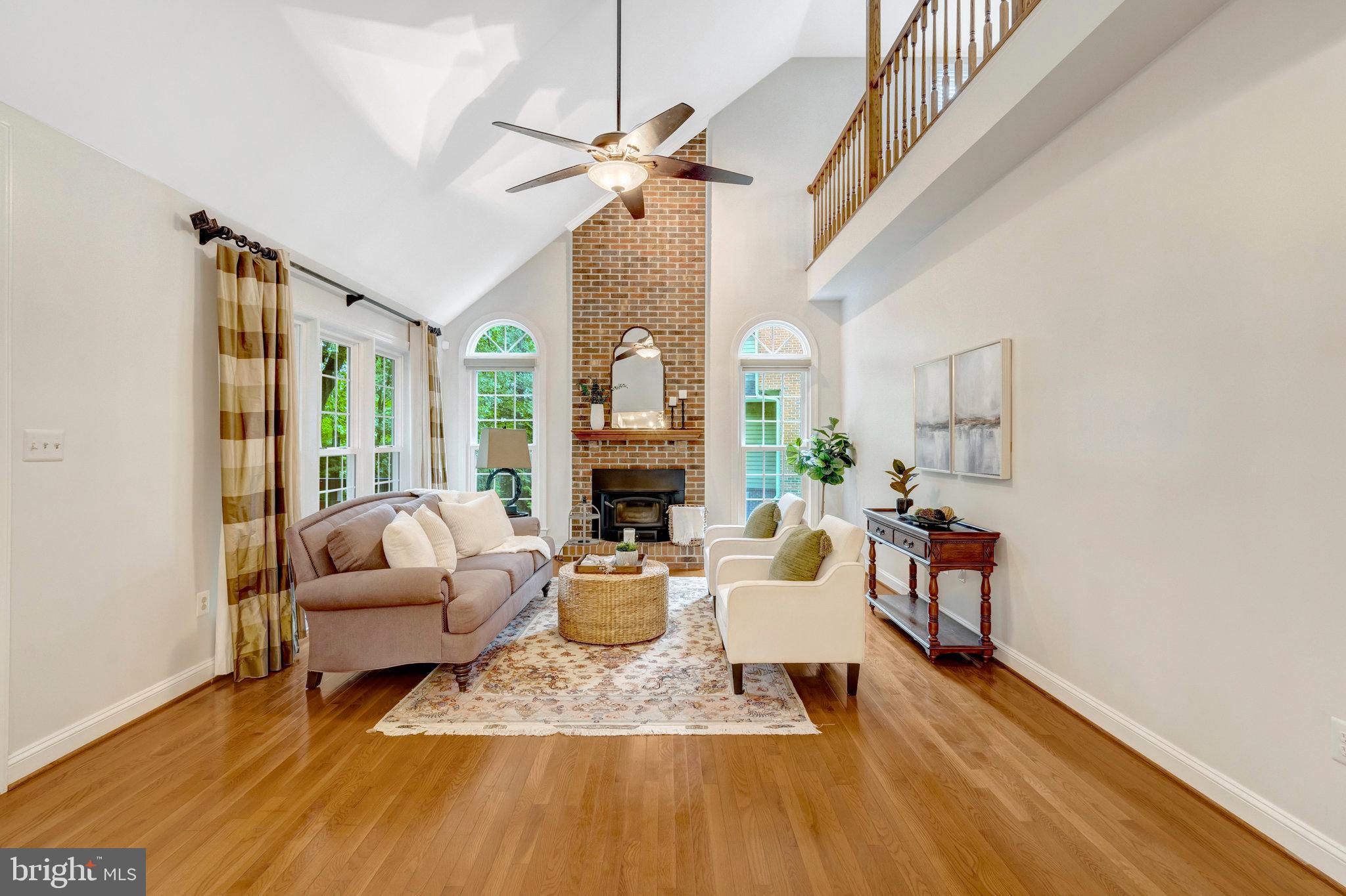 11181 Longwood Grove Drive Reston, VA 20194 - Photo 25 of 94 a living room with furniture fireplace and a window