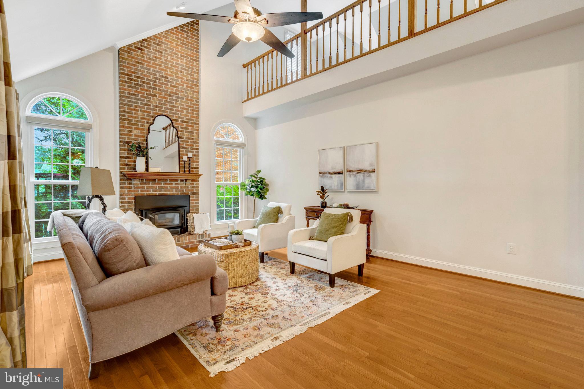 11181 Longwood Grove Drive Reston, VA 20194 - Photo 26 of 94 a living room with furniture and a fireplace