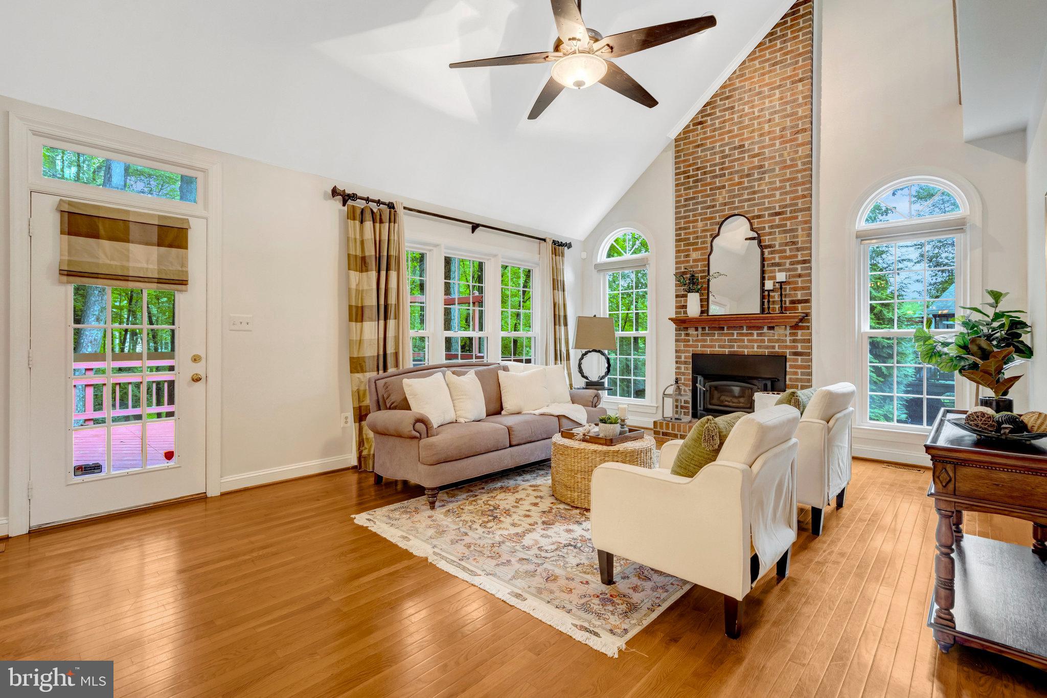 11181 Longwood Grove Drive Reston, VA 20194 - Photo 27 of 94 a living room with furniture fireplace and a flat screen tv