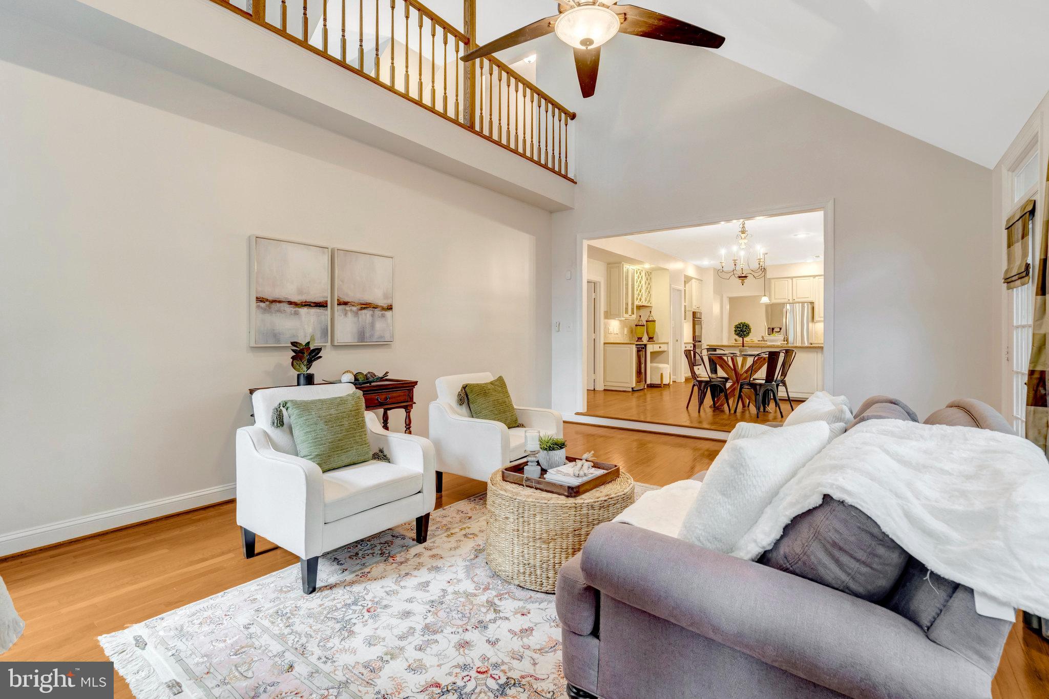 11181 Longwood Grove Drive Reston, VA 20194 - Photo 28 of 94 a living room with furniture and a wooden floor