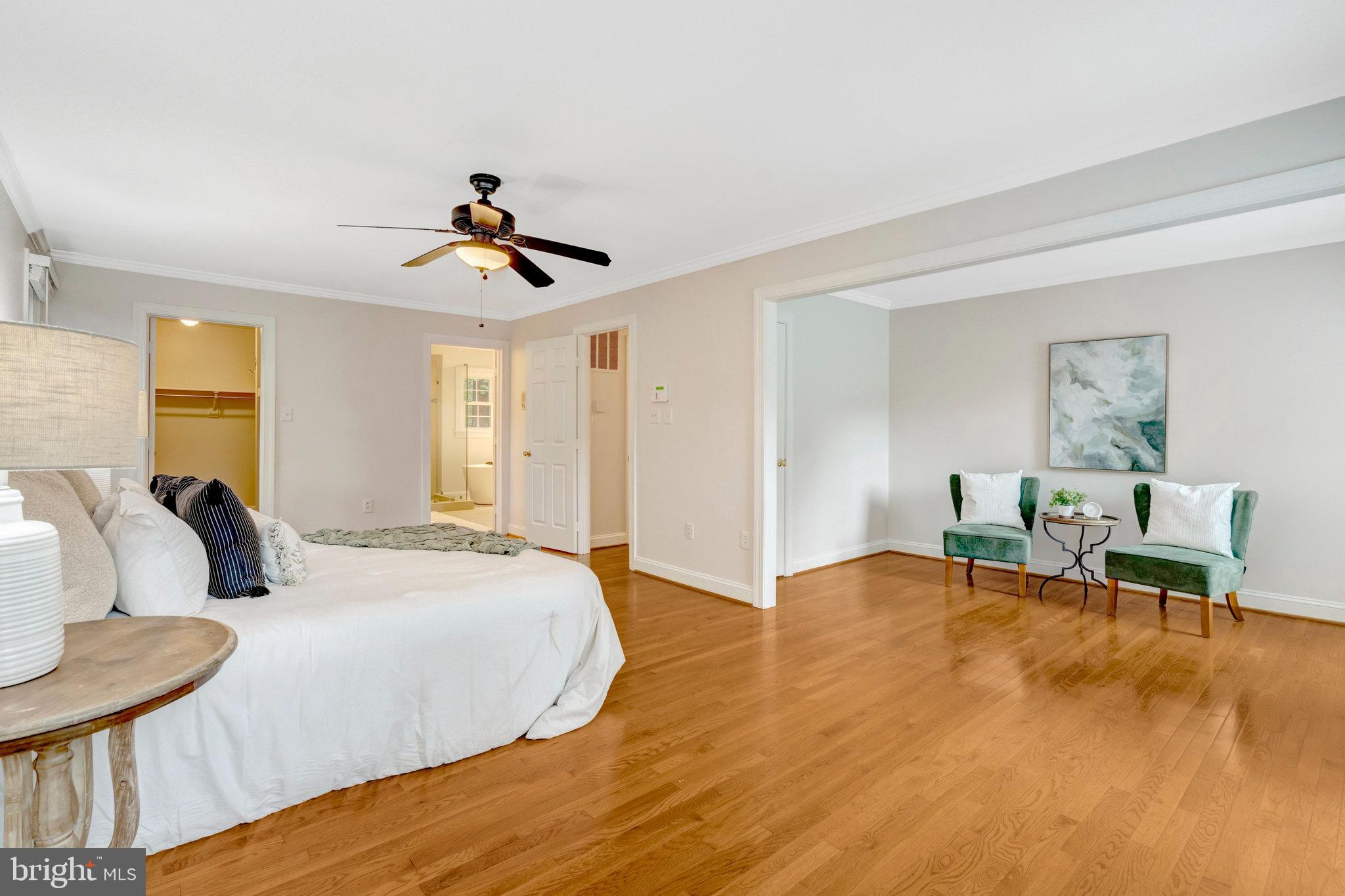 11181 Longwood Grove Drive Reston, VA 20194 - Photo 40 of 94 a bedroom with a bed and wooden floor
