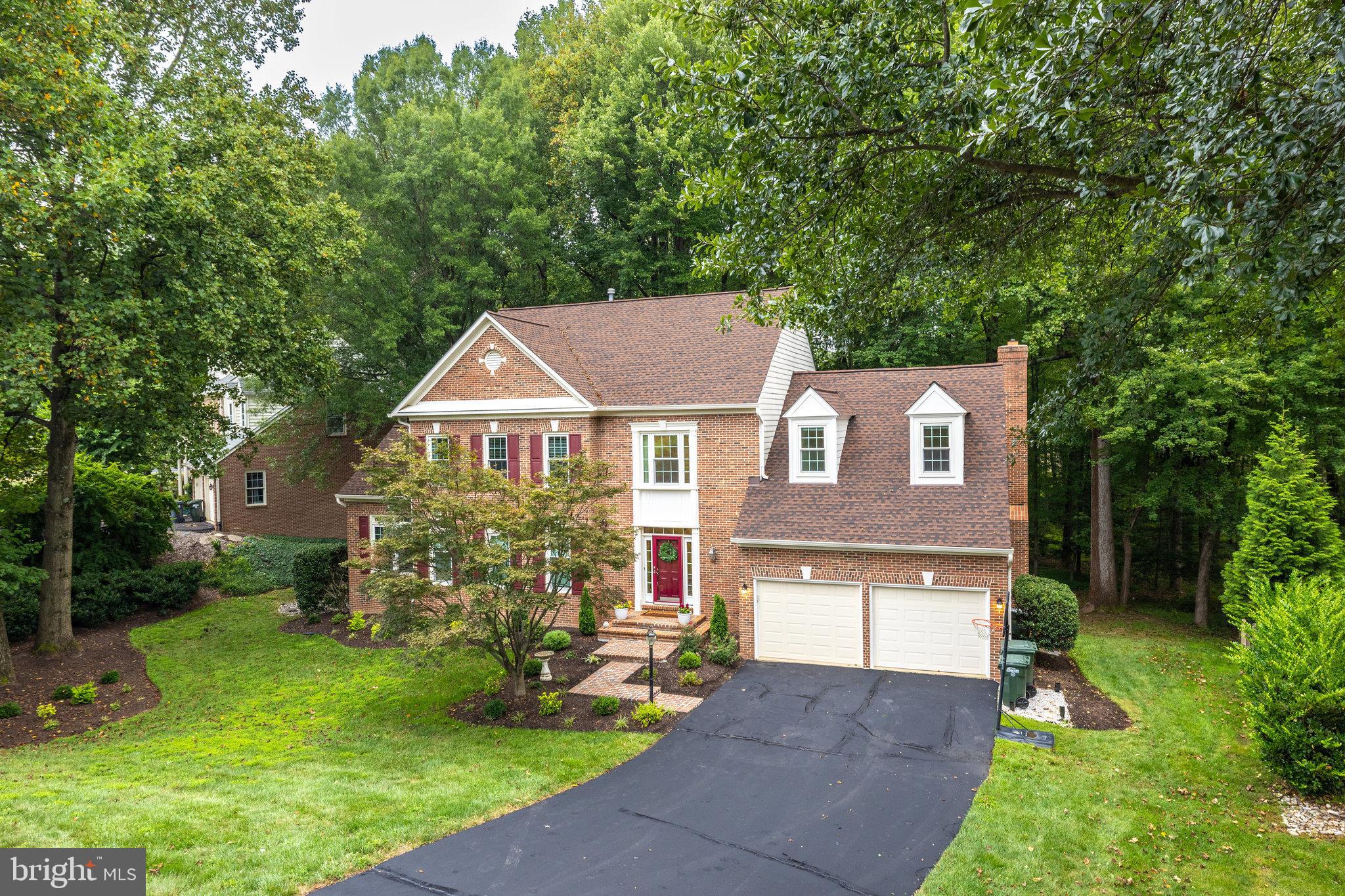 11181 Longwood Grove Drive Reston, VA 20194 - Photo 4 of 94 a front view of a house with garden