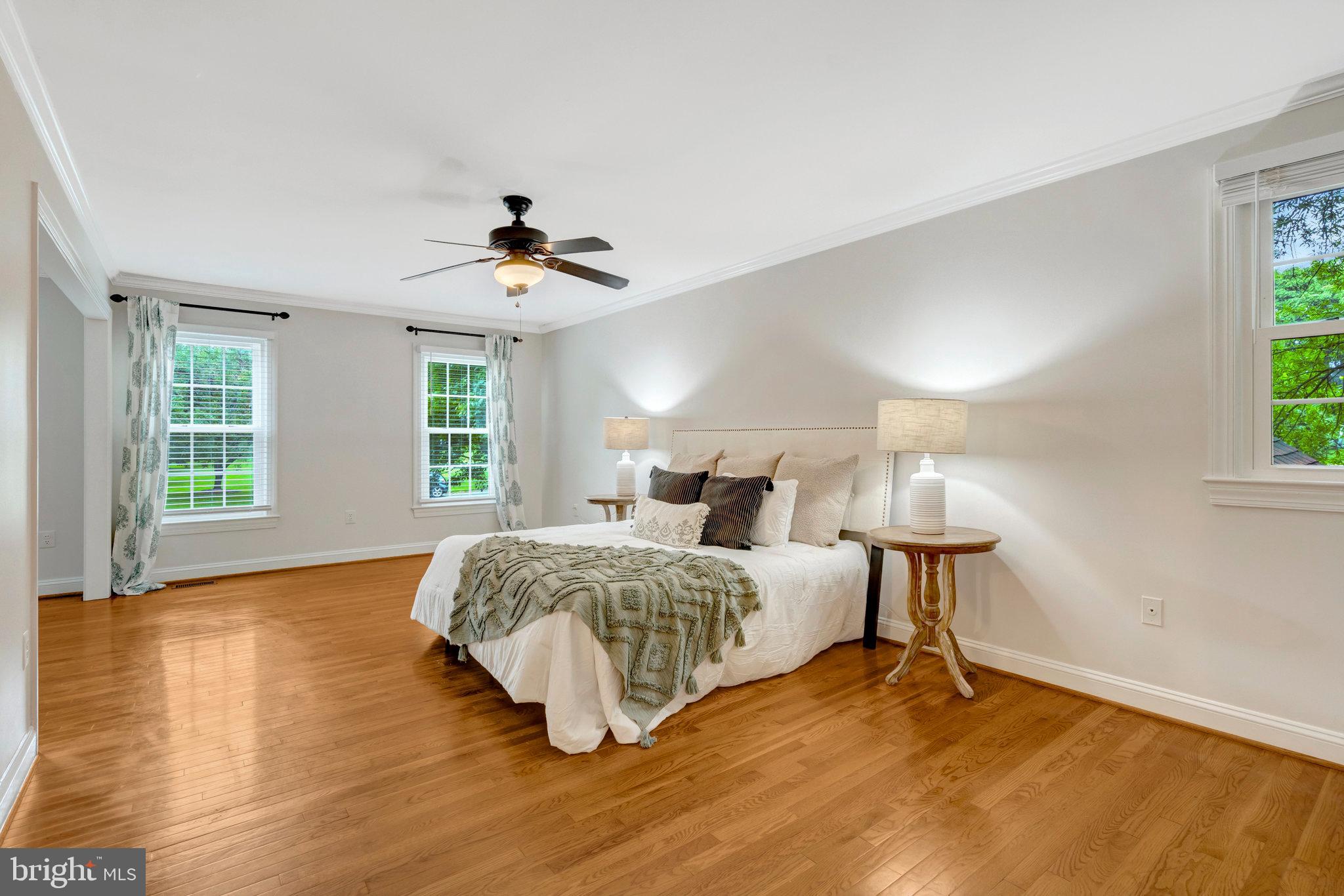11181 Longwood Grove Drive Reston, VA 20194 - Photo 43 of 94 a spacious bedroom with a bed and a window