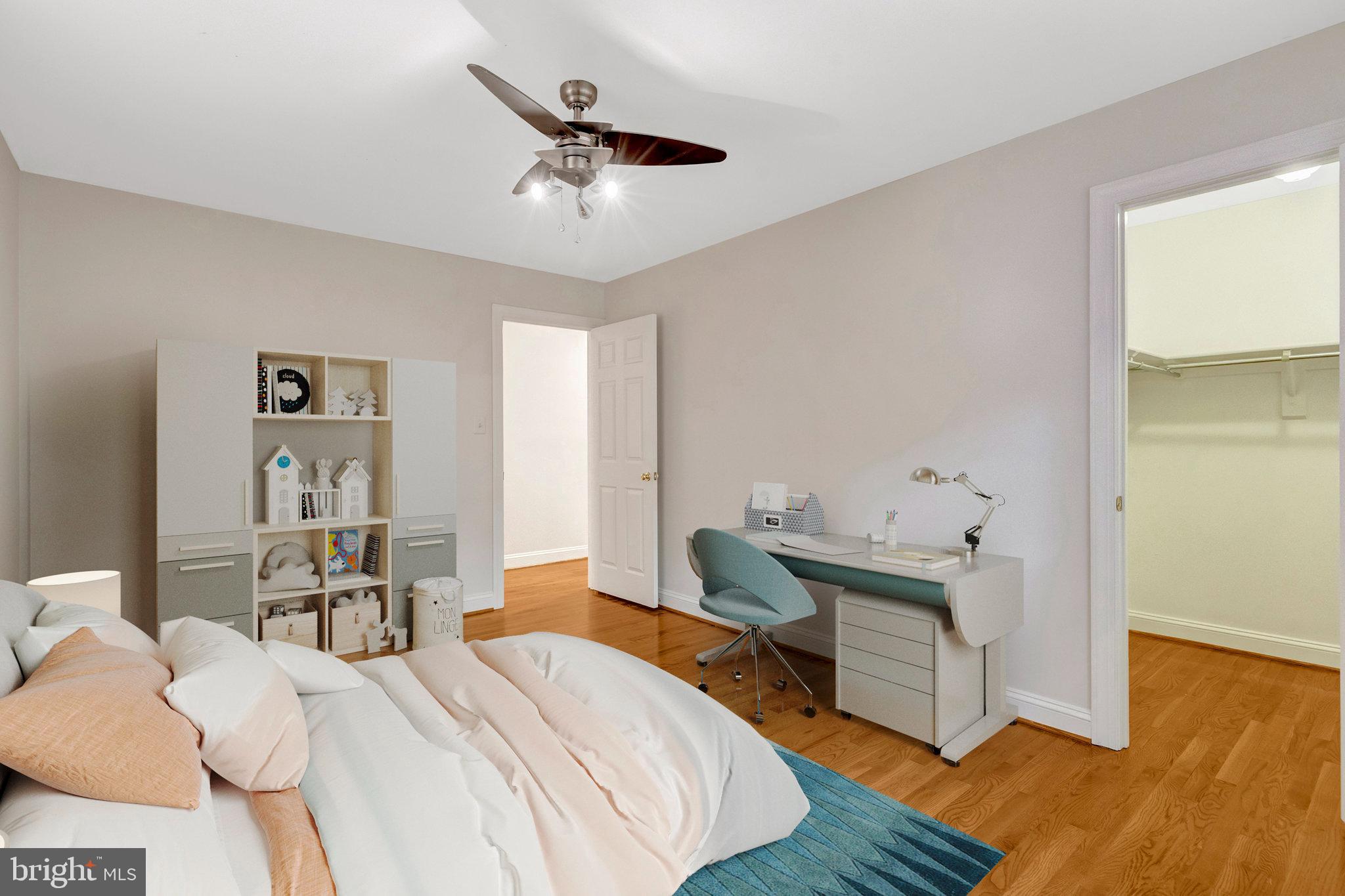 11181 Longwood Grove Drive Reston, VA 20194 - Photo 49 of 94 a bedroom with a bed and wooden floor