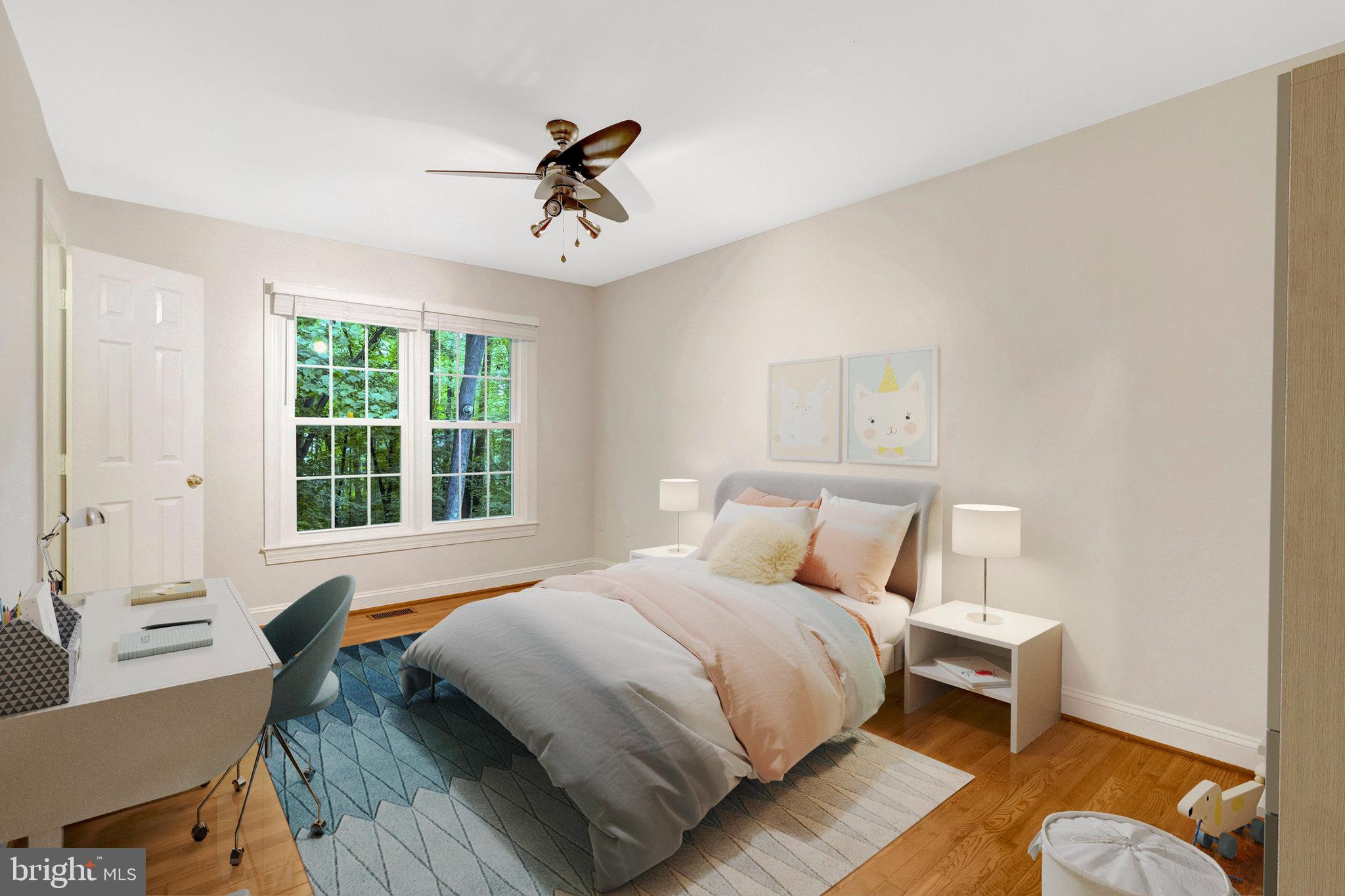 11181 Longwood Grove Drive Reston, VA 20194 - Photo 51 of 94 a bedroom with a bed and wooden floor