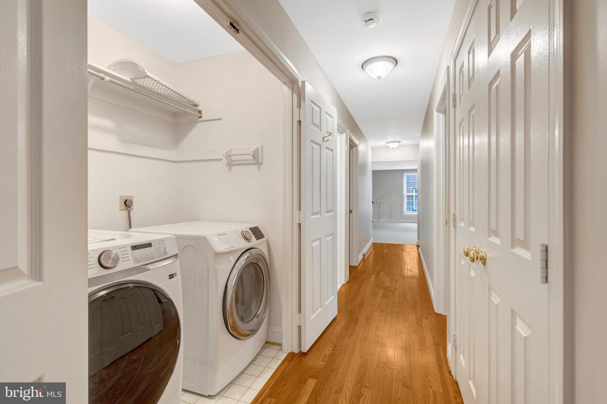 11181 Longwood Grove Drive Reston, VA 20194 - Photo 56 of 94 a view of a hallway with washer and dryer