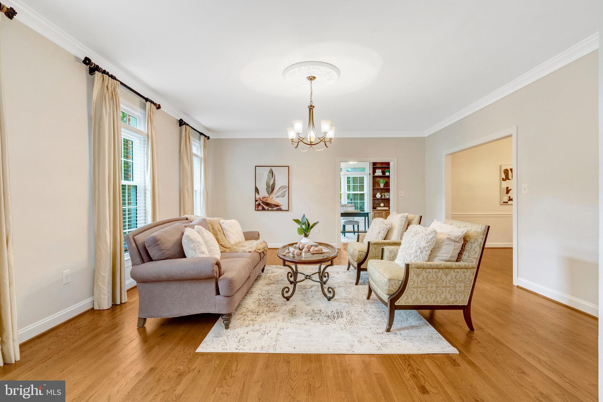 11181 Longwood Grove Drive Reston, VA 20194 - Photo 8 of 94 a living room with furniture and a chandelier
