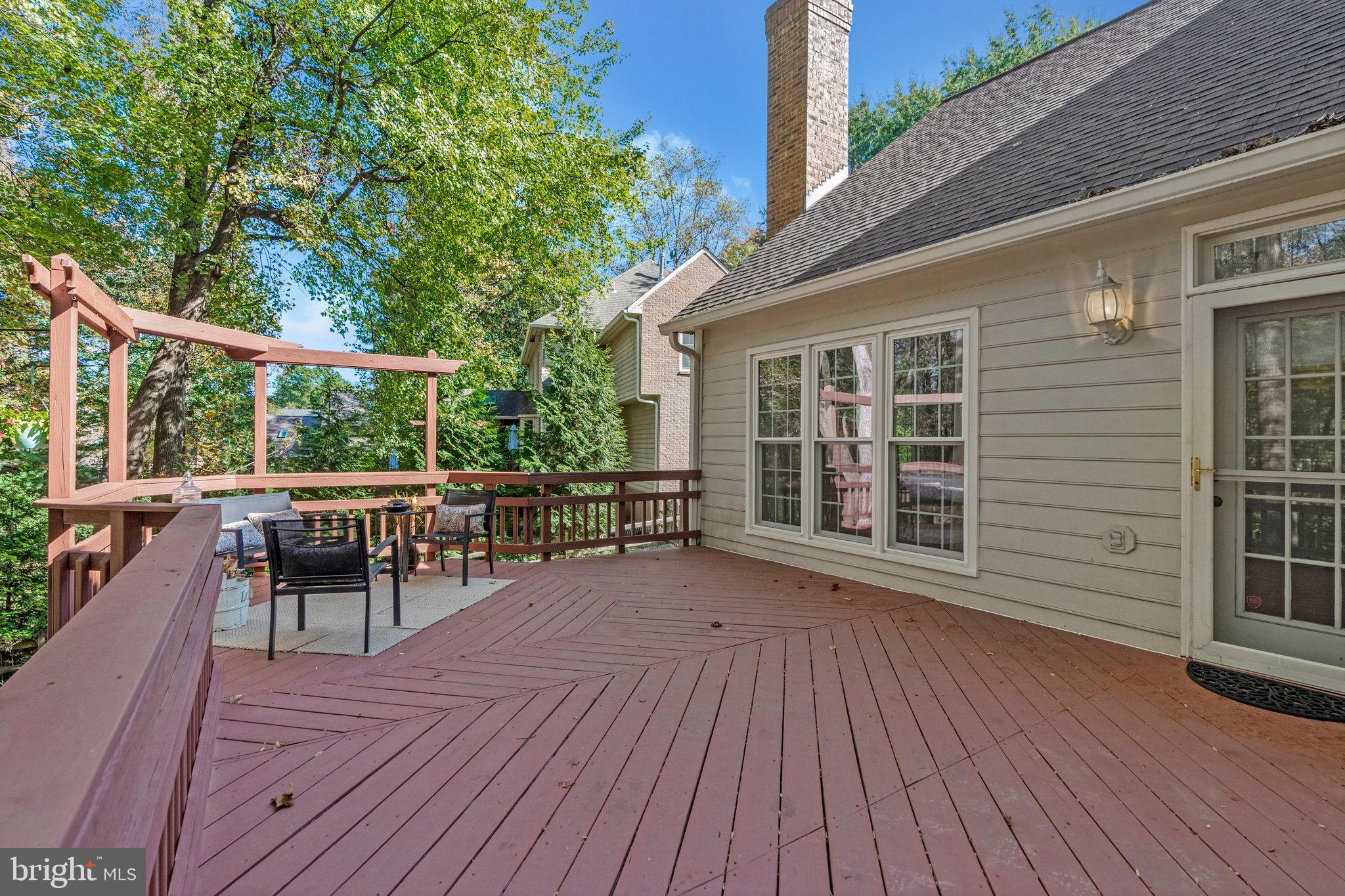 11181 Longwood Grove Drive Reston, VA 20194 - Photo 82 of 94 Charming deck surrounded by lush greenery.