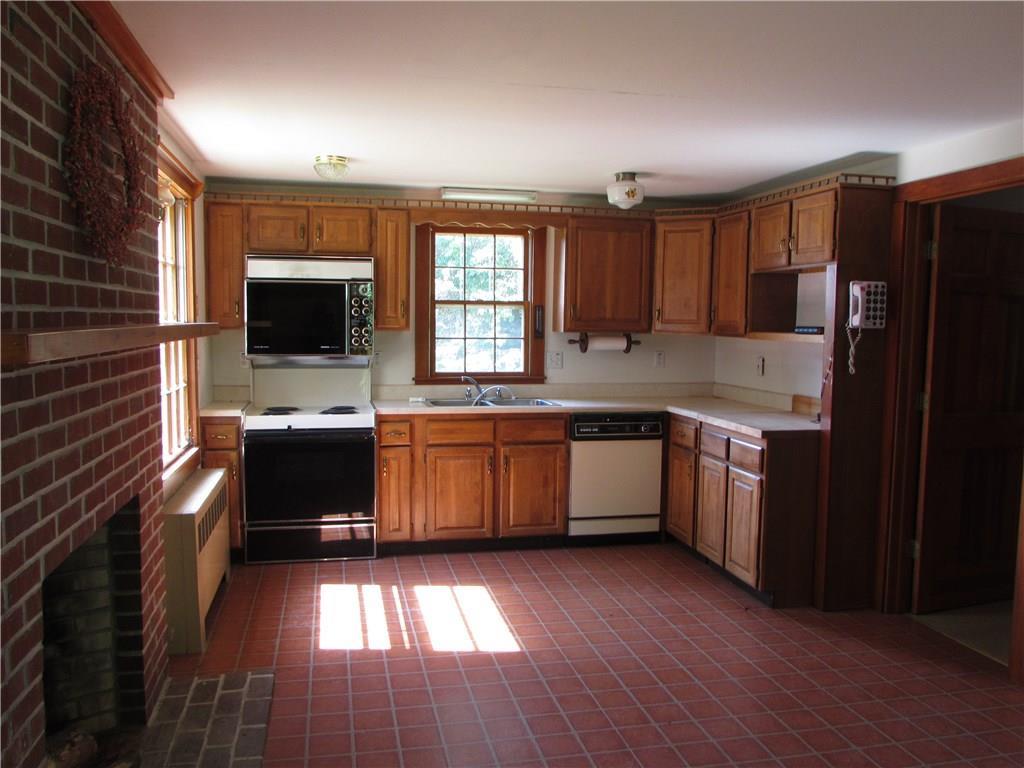 171 Rope Ferry Road Sedgwick, ME 04676 - Photo 6 of 28 Kitchen with wood burning fireplace.