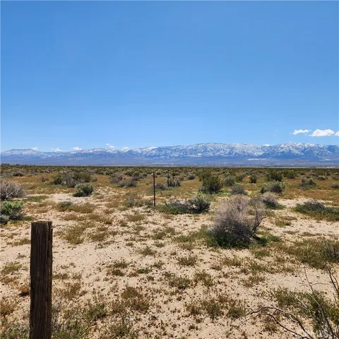 a view of a large body of water with a building in the background