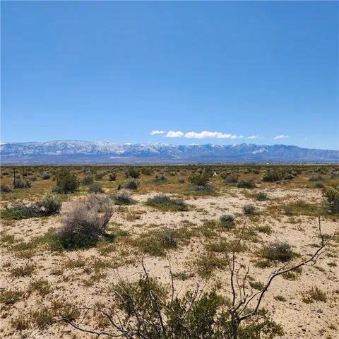 a view of a large body of water and mountain