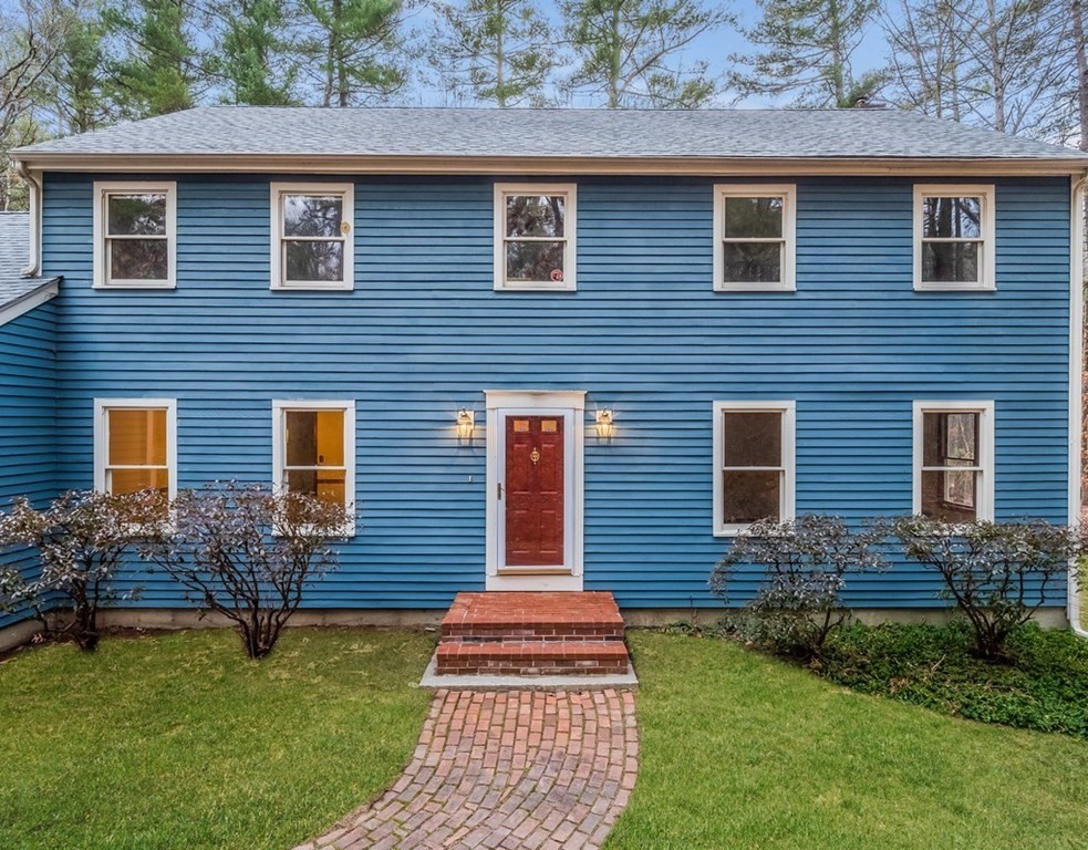 4 Uplands Road Littleton, MA 01460 - Photo 1 of 39 a front view of a house with garden