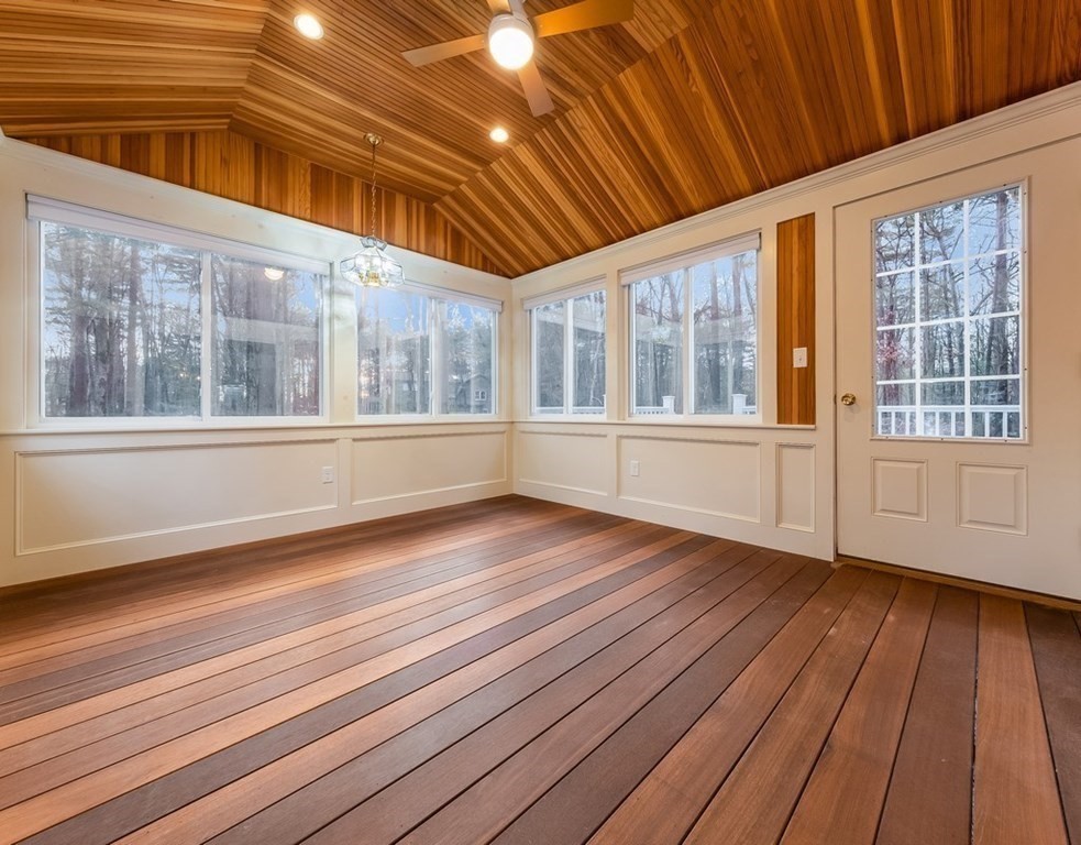 4 Uplands Road Littleton, MA 01460 - Photo 15 of 39 a view of an empty room with wooden floor and windows