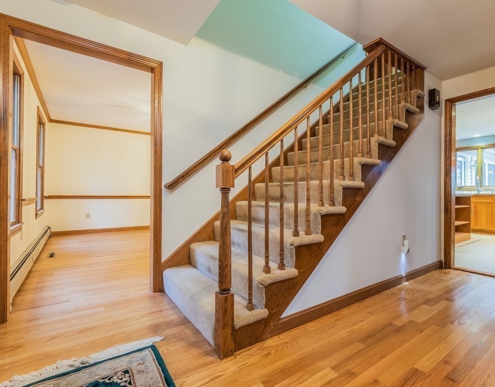 4 Uplands Road Littleton, MA 01460 - Photo 16 of 39 a view of staircase with wooden floor and white walls