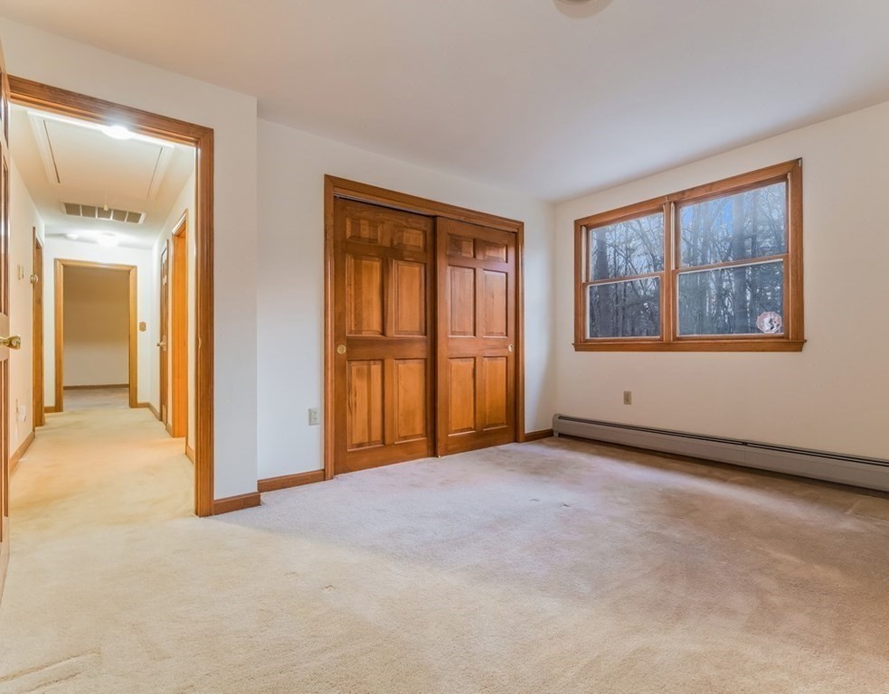 4 Uplands Road Littleton, MA 01460 - Photo 31 of 39 an empty room with windows and closet