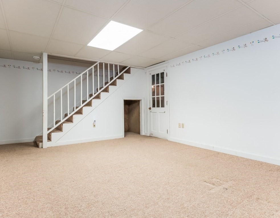 4 Uplands Road Littleton, MA 01460 - Photo 33 of 39 a view of an empty room with stairs