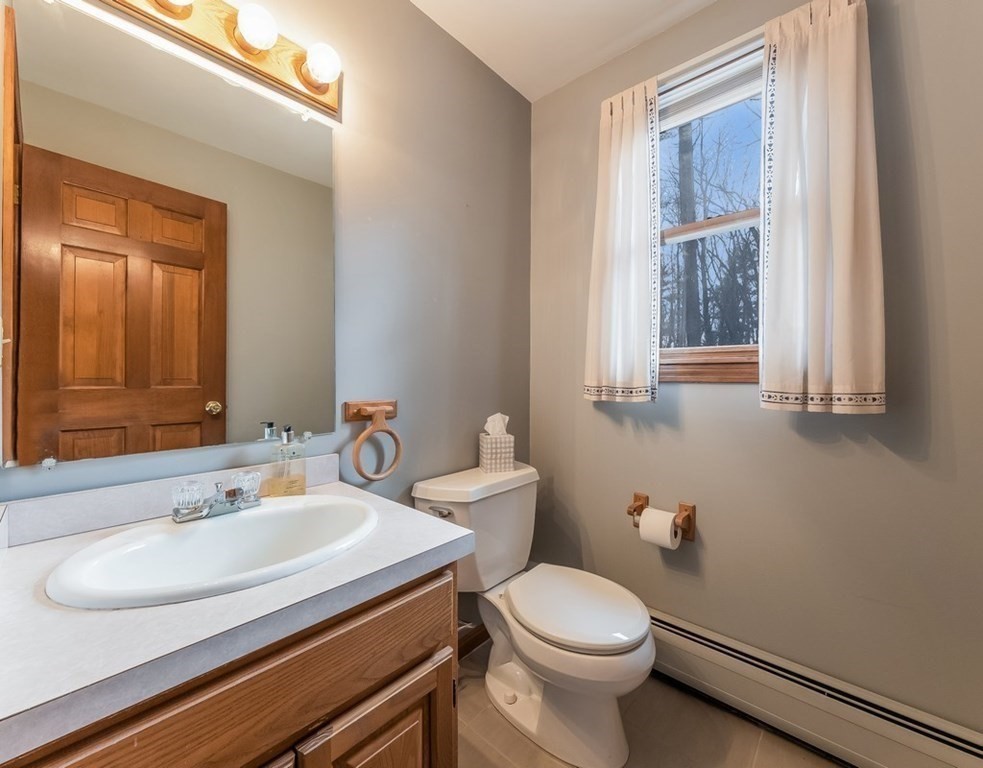 4 Uplands Road Littleton, MA 01460 - Photo 38 of 39 a bathroom with a sink and a toilet