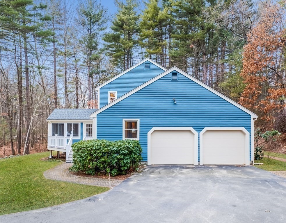 4 Uplands Road Littleton, MA 01460 - Photo 5 of 39 a view of front of house with a yard and garage