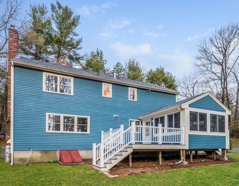 4 Uplands Road Littleton, MA 01460 - Photo 7 of 39 a front view of a house with garden