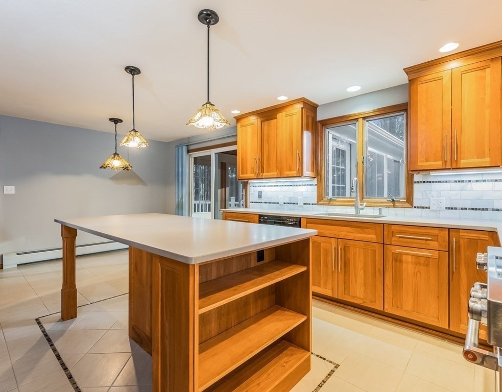 4 Uplands Road Littleton, MA 01460 - Photo 10 of 39 a kitchen with stainless steel appliances granite countertop a stove a sink and a refrigerator