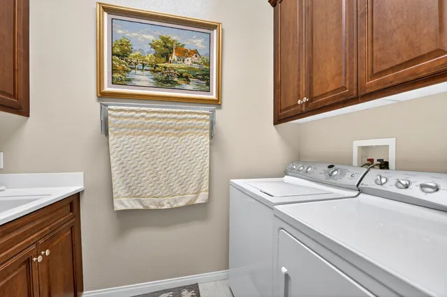 a view of a tables and chairs under an umbrella