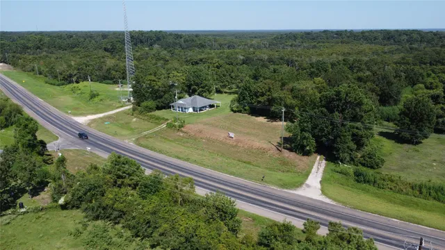 a view of a yard with a wooden fence