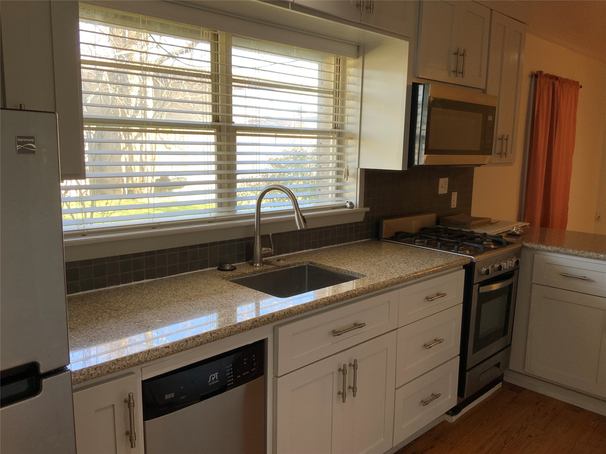 100 West Madison Street, Unit A Trinity, TX 75862 - Photo 15 of 24 a kitchen with a sink and a window