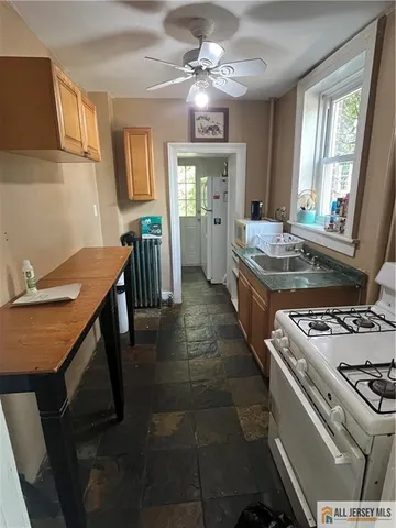 a kitchen with a stove and a sink
