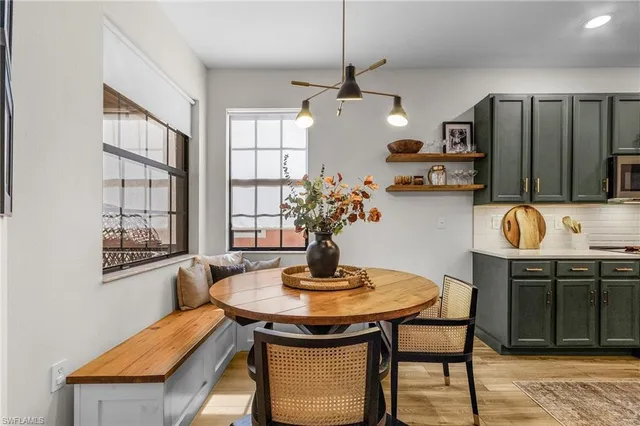 a dining room with furniture and window