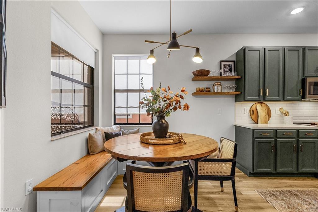 3793 Costa Maya Way, Unit 202 Estero, FL 33928 - Photo 5 of 28 a dining room with furniture and window
